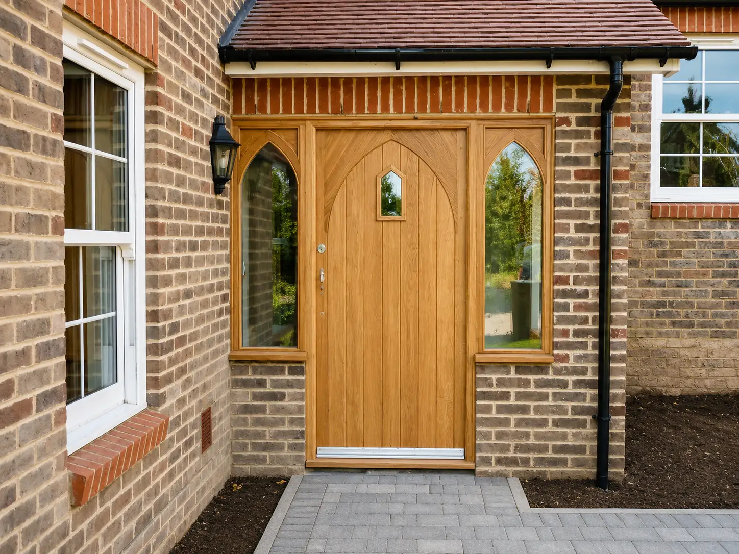 Oak front door with arched sidelights
